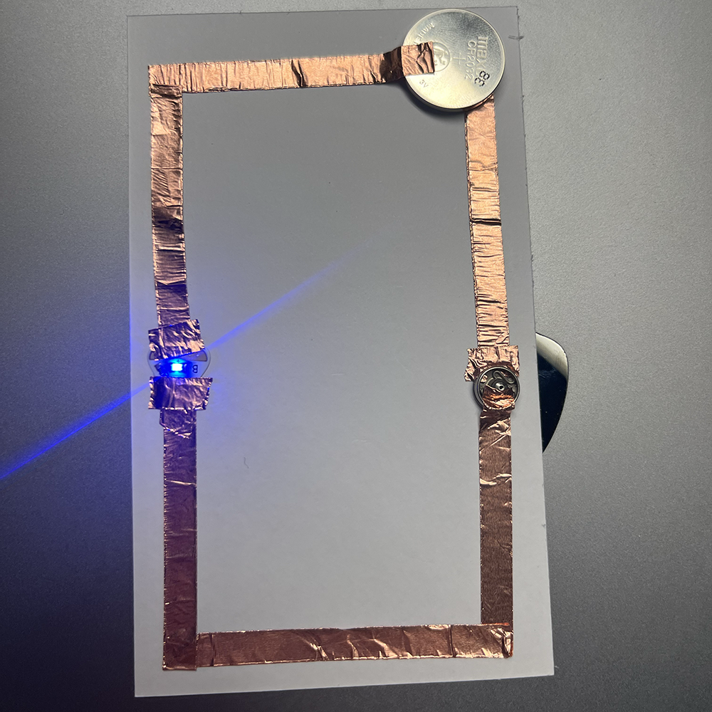 Making test of low voltage electricity using metal button.